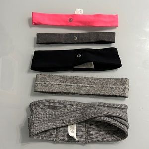 5 Lululemon head bands. 3 shown with labels, 2 without.